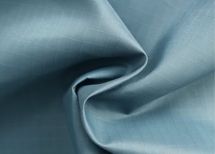 Polyester nylon high-strength fabric close-up, durable wrinkle-resistant quick-dry activewear and outerwear textiles